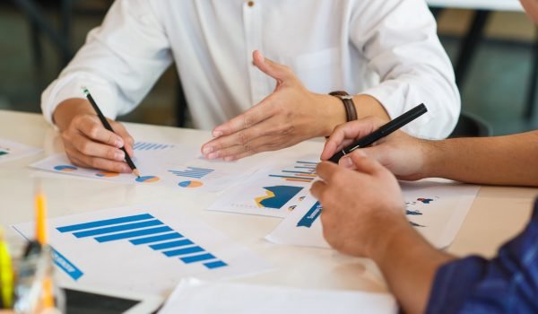 Business Corporate team brainstorming with chart and checking and analysis